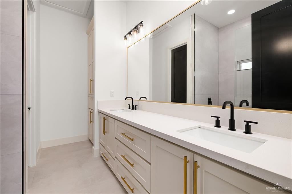 200 Micaela Road, Unit SERVICE Penitas, TX 78576 - Photo 23 of 30 a bathroom with a double vanity sink mirror and double