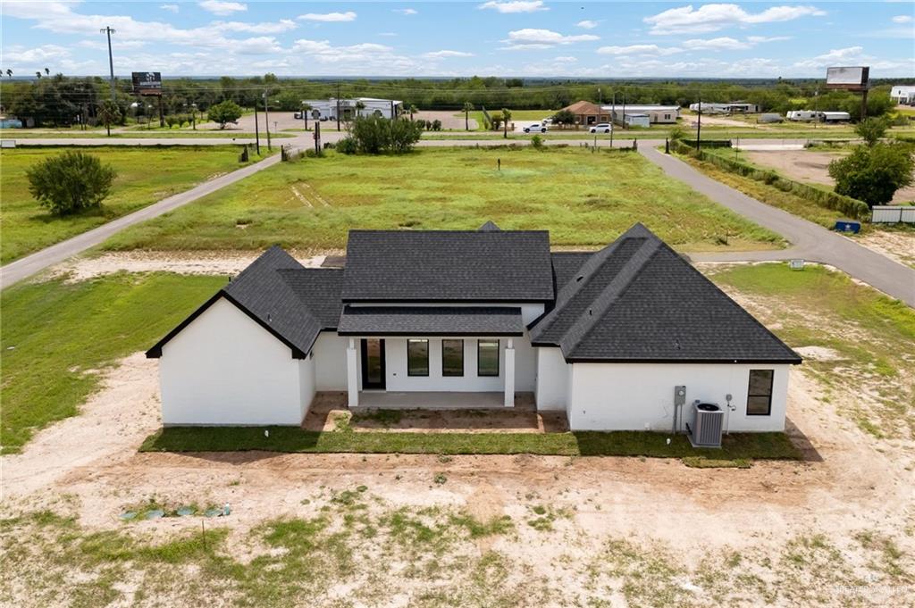 200 Micaela Road, Unit SERVICE Penitas, TX 78576 - Photo 25 of 30 a view of a house with swimming pool and a yard