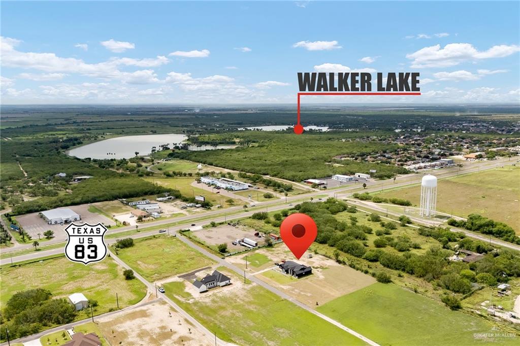 200 Micaela Road, Unit SERVICE Penitas, TX 78576 - Photo 28 of 30 a front view of a pool a dinning table and chairs