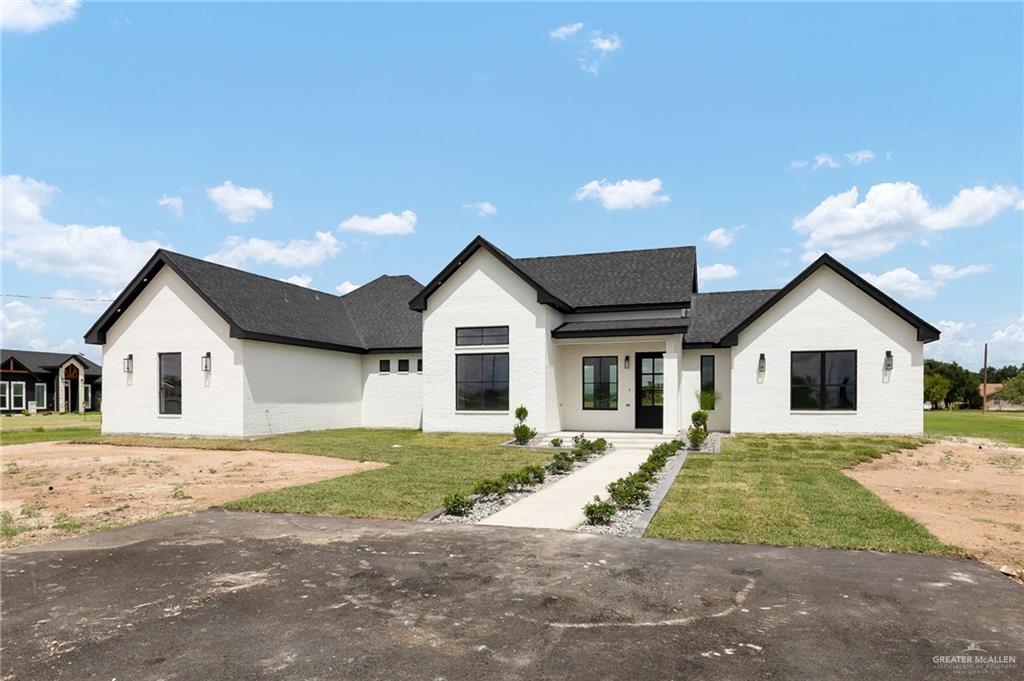 200 Micaela Road, Unit SERVICE Penitas, TX 78576 - Photo 5 of 30 a view of front of house with a yard