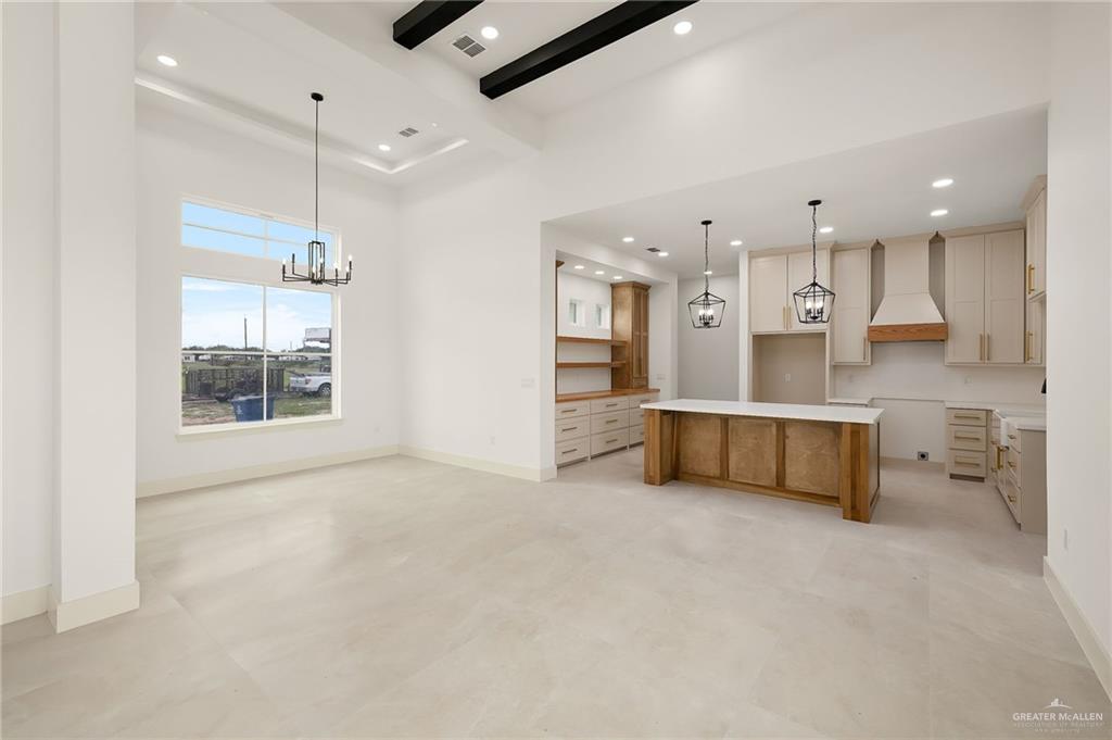 200 Micaela Road, Unit SERVICE Penitas, TX 78576 - Photo 10 of 30 a large kitchen with a large counter top a sink stainless steel appliances and cabinets