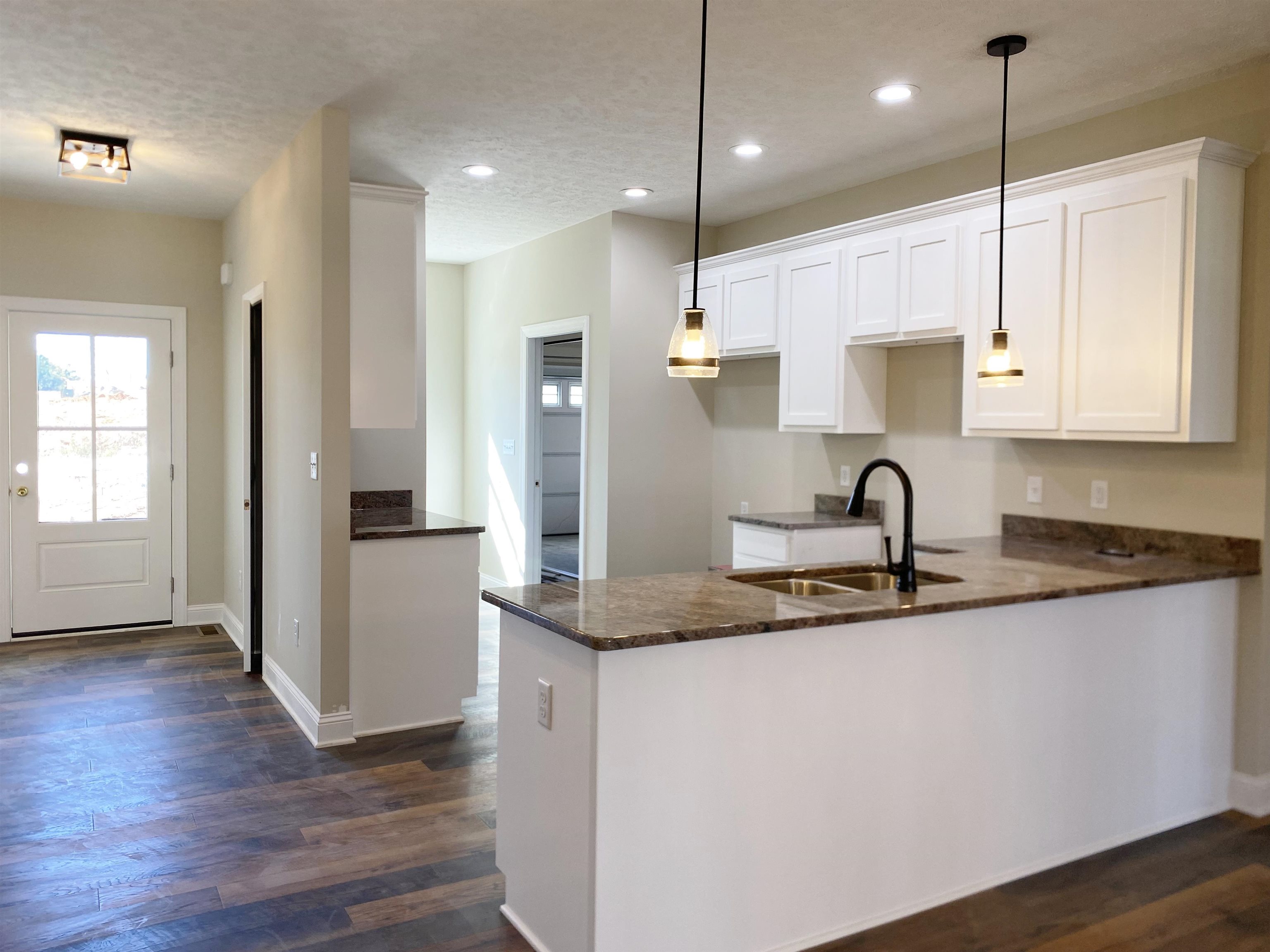 117 Spring Ridge Drive Stuarts Draft, VA 24477 - Photo 2 of 12 a kitchen with stainless steel appliances granite countertop a sink a refrigerator a stove a kitchen island and wooden floor