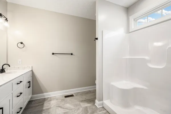 a bathroom with a bathtub and a sink