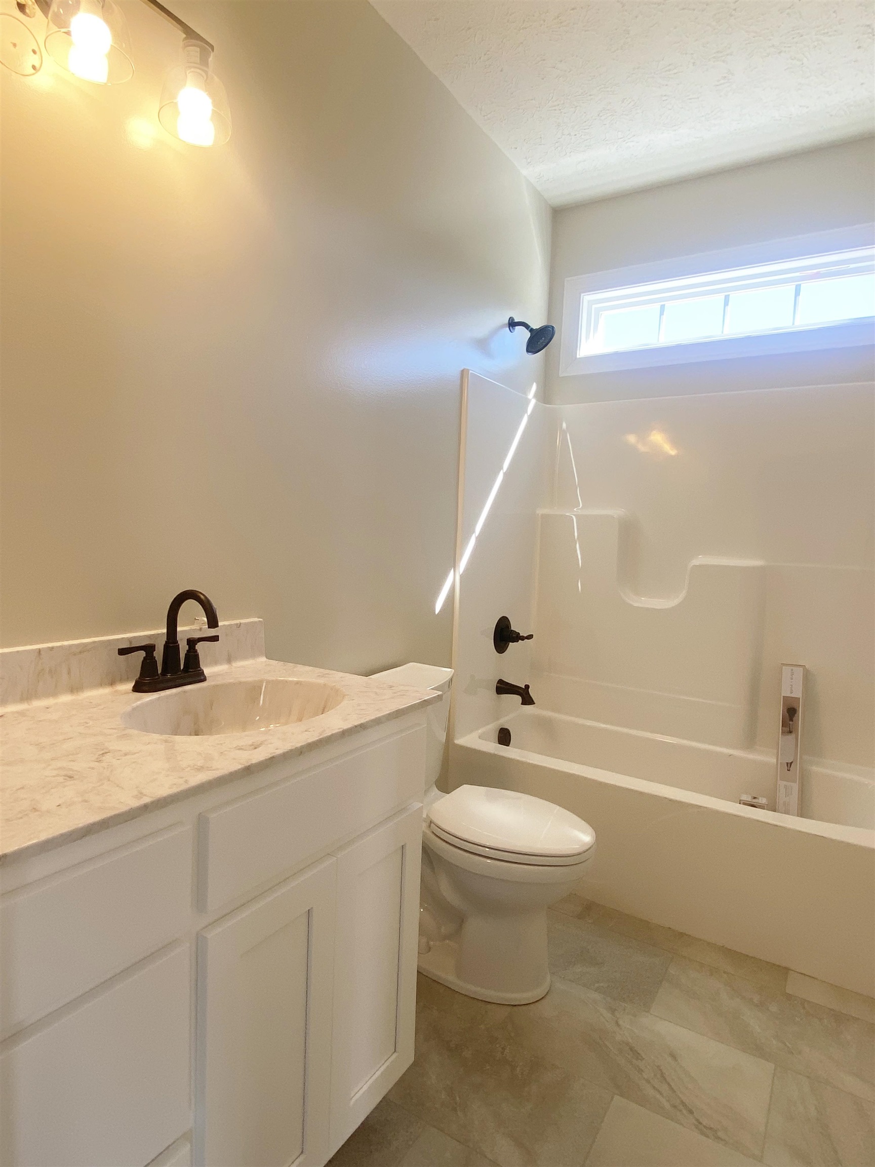117 Spring Ridge Drive Stuarts Draft, VA 24477 - Photo 6 of 12 a bathroom with a granite countertop sink a toilet and bathtub