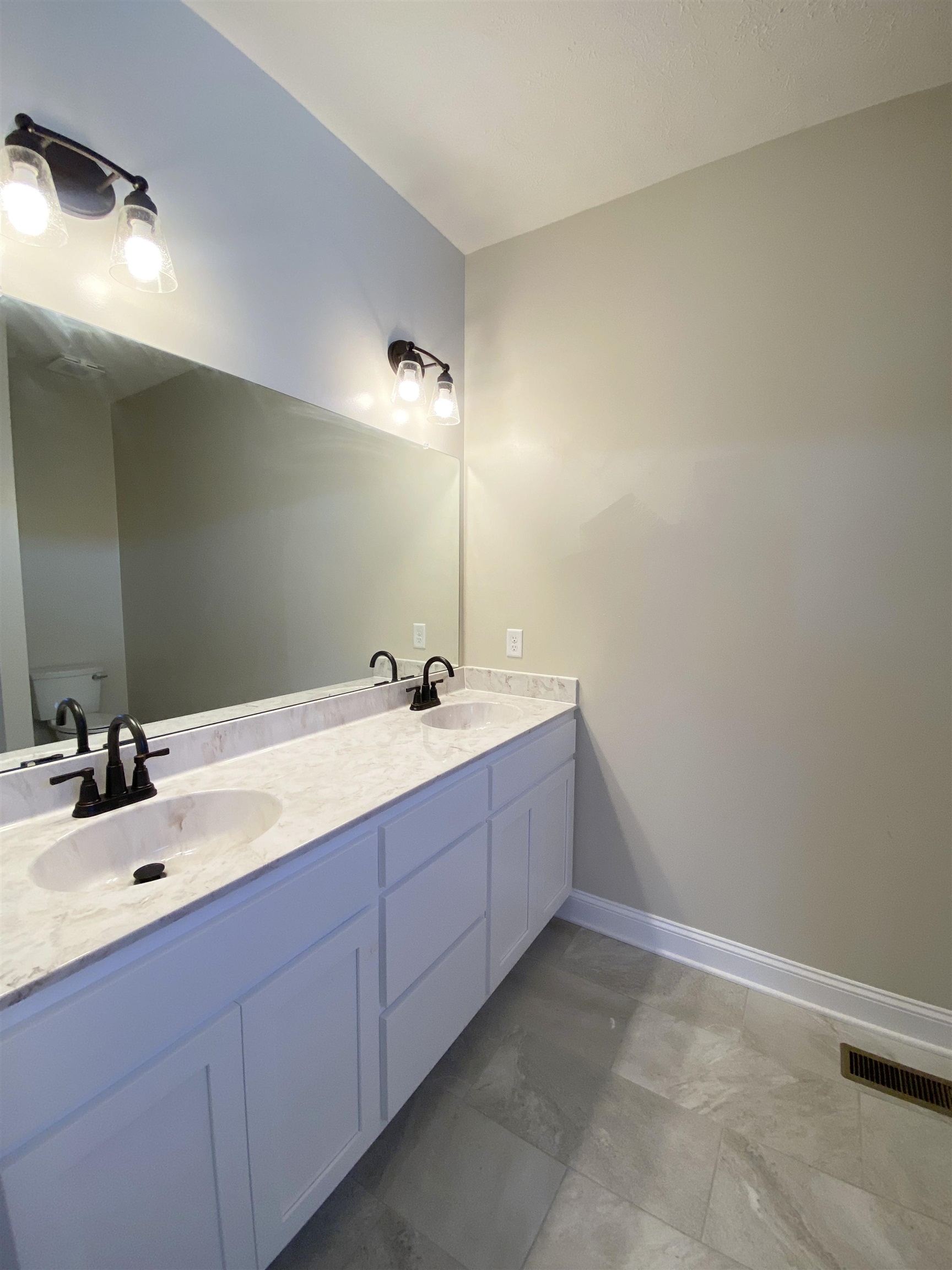 117 Spring Ridge Drive Stuarts Draft, VA 24477 - Photo 10 of 12 a bathroom with double vanity sink and a mirror