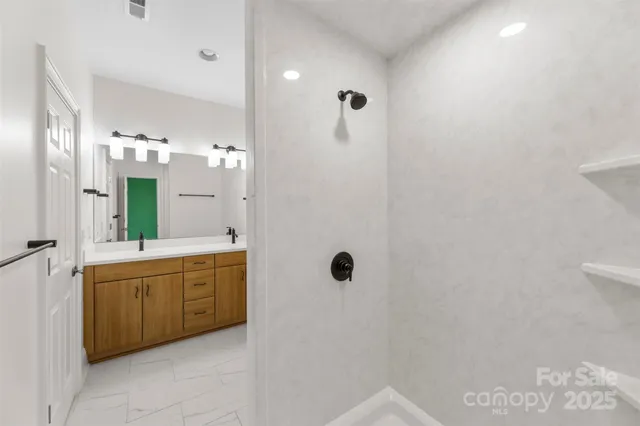 a view of an empty room with a window