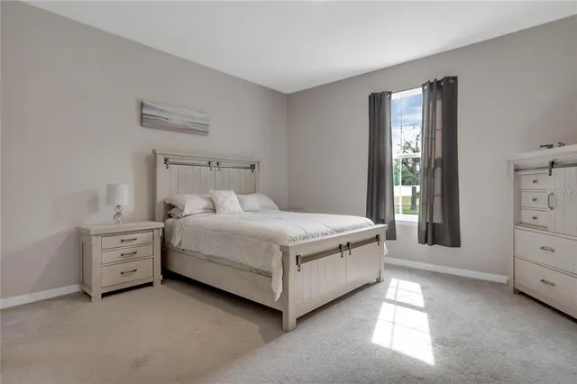 a room with a bed and a night stand