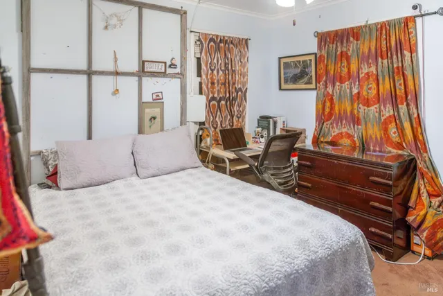 a bedroom with a bed and a cabinets