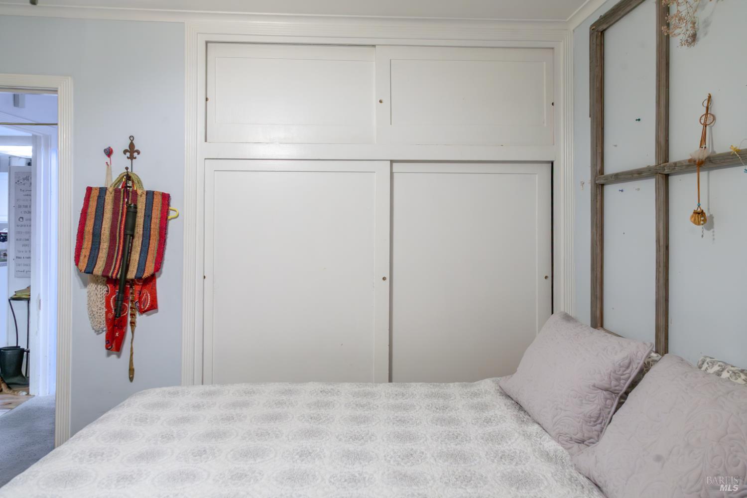 1138 Lokoya Road Napa, CA 94558 - Photo 28 of 28 a bedroom with a bed and a cabinets