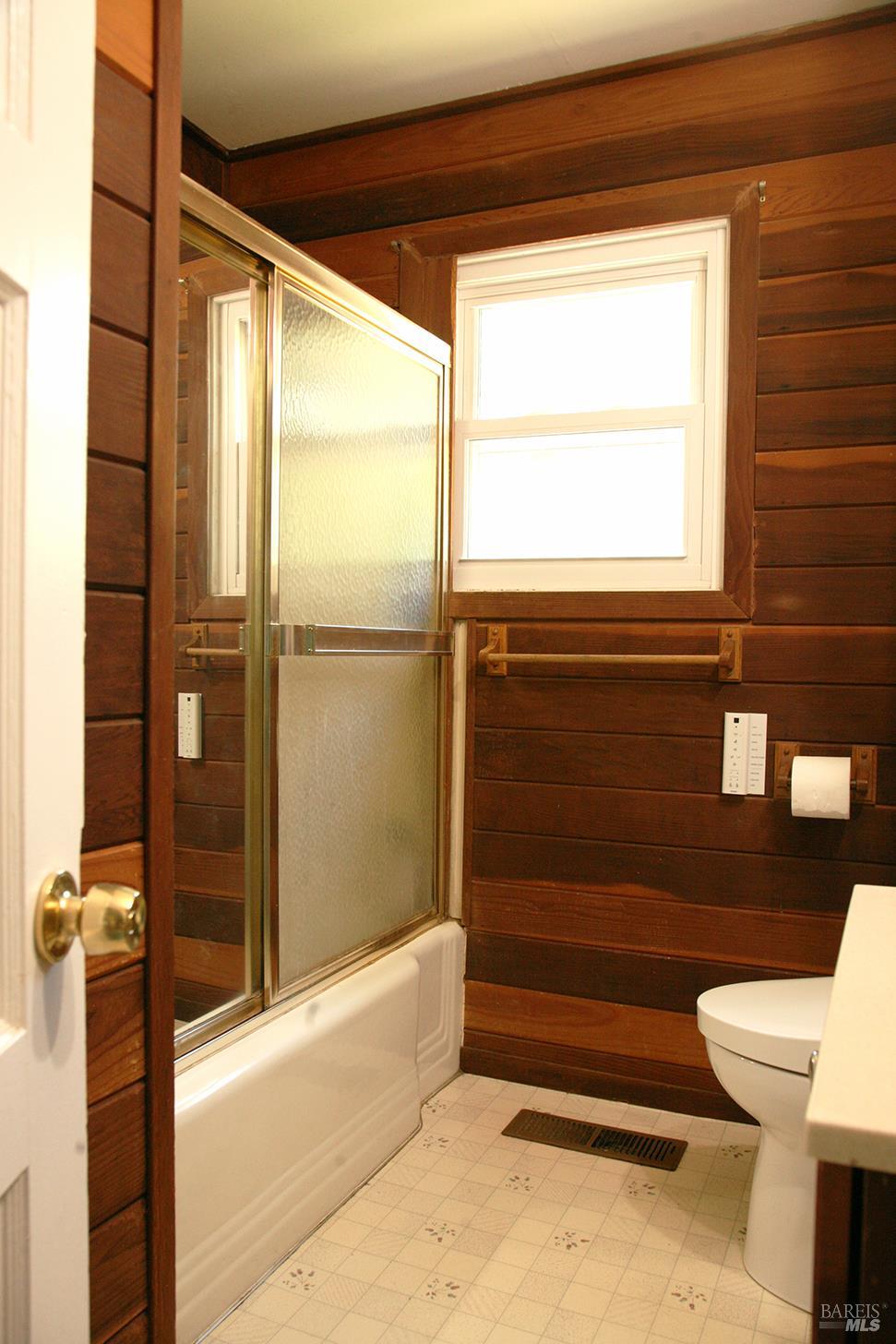 1138 Lokoya Road Napa, CA 94558 - Photo 32 of 35 a bathroom with a toilet and a shower