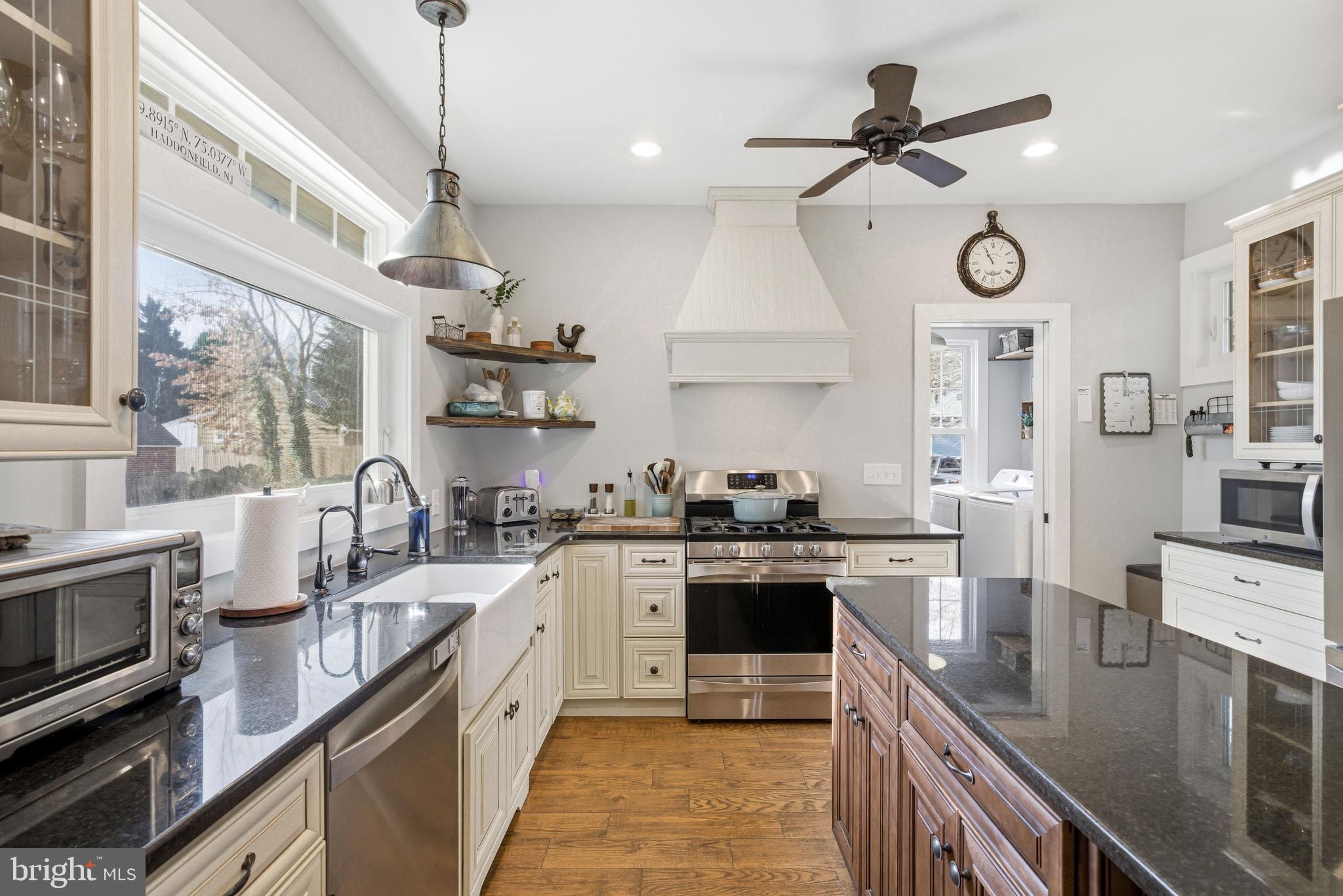 612 Grove Street Haddonfield, NJ 08033 - Photo 24 of 64 a open kitchen with stainless steel appliances granite countertop a sink a stove and a wooden floors