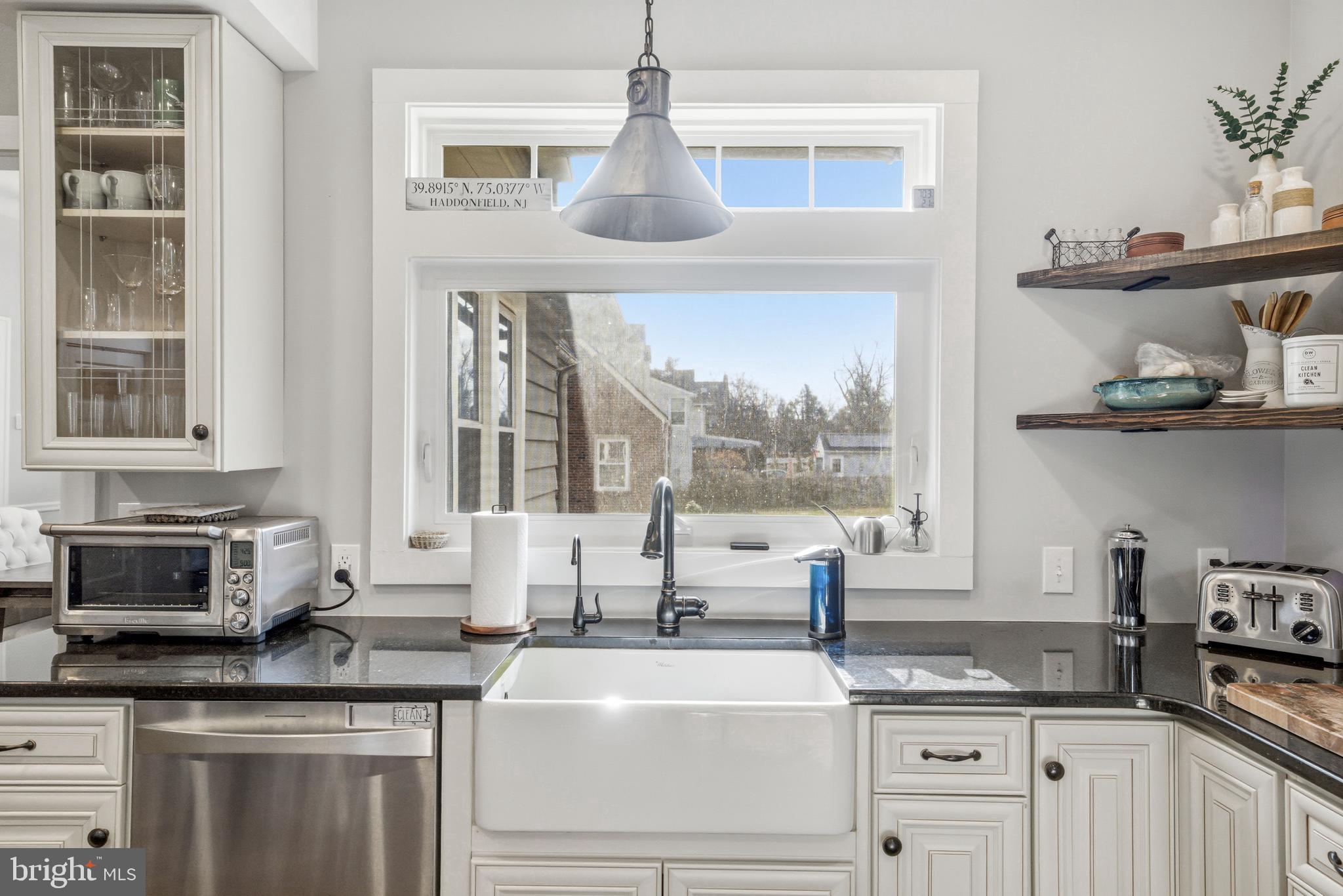612 Grove Street Haddonfield, NJ 08033 - Photo 26 of 64 a kitchen with granite countertop a sink and a stove next to a window