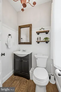 a bedroom with a bed ceiling fan and a window