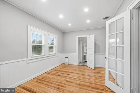 a bathroom with a toilet a sink and a window