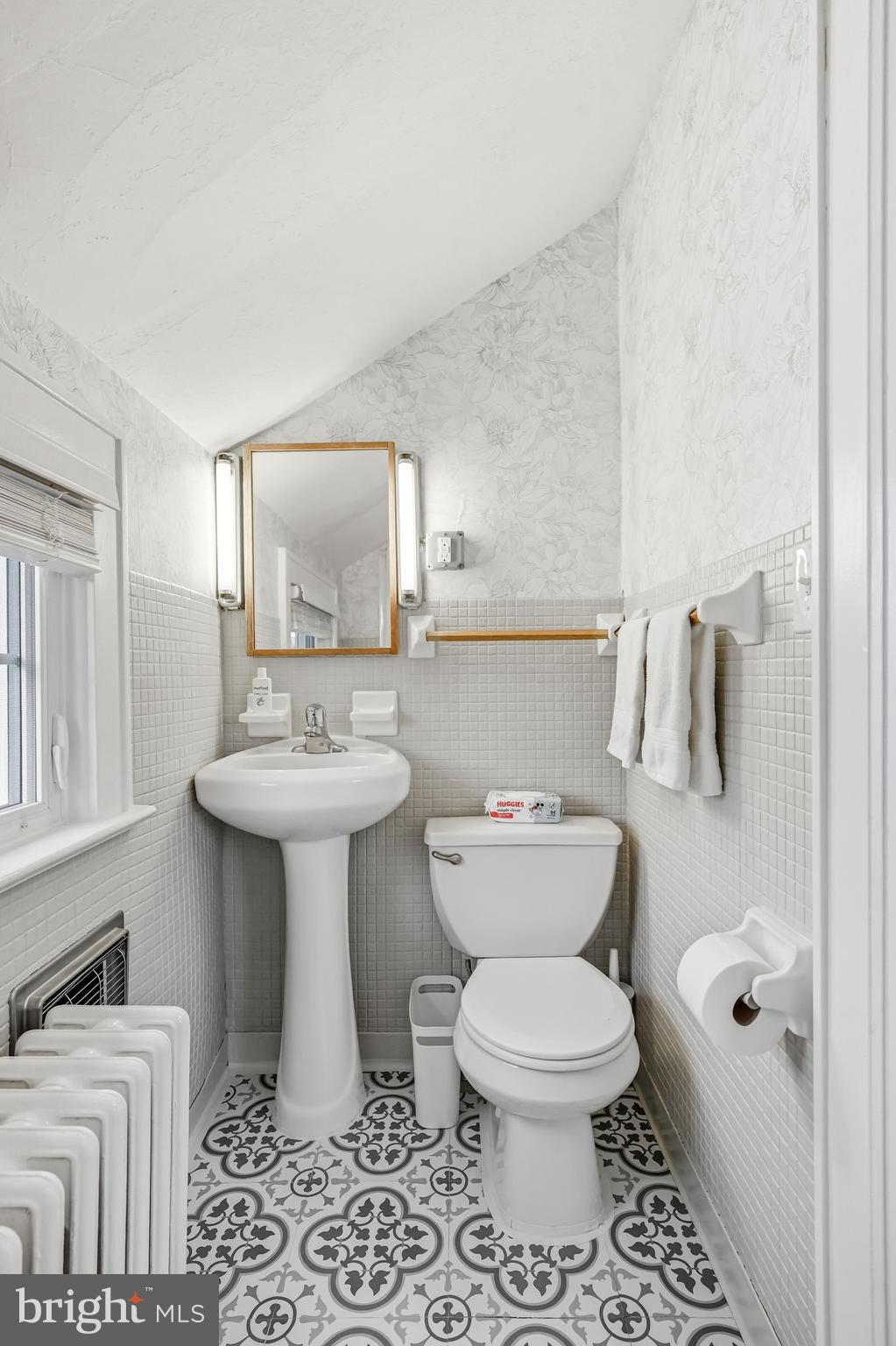 612 Grove Street Haddonfield, NJ 08033 - Photo 37 of 64 a bathroom with a toilet sink and mirror