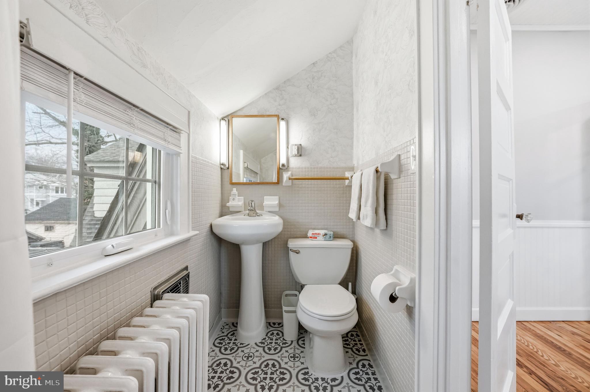 612 Grove Street Haddonfield, NJ 08033 - Photo 38 of 64 a bathroom with a toilet a sink and a window