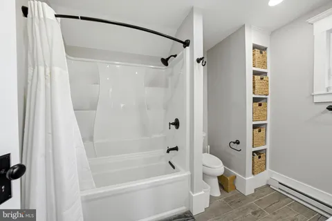 an aerial view of a house with a swimming pool