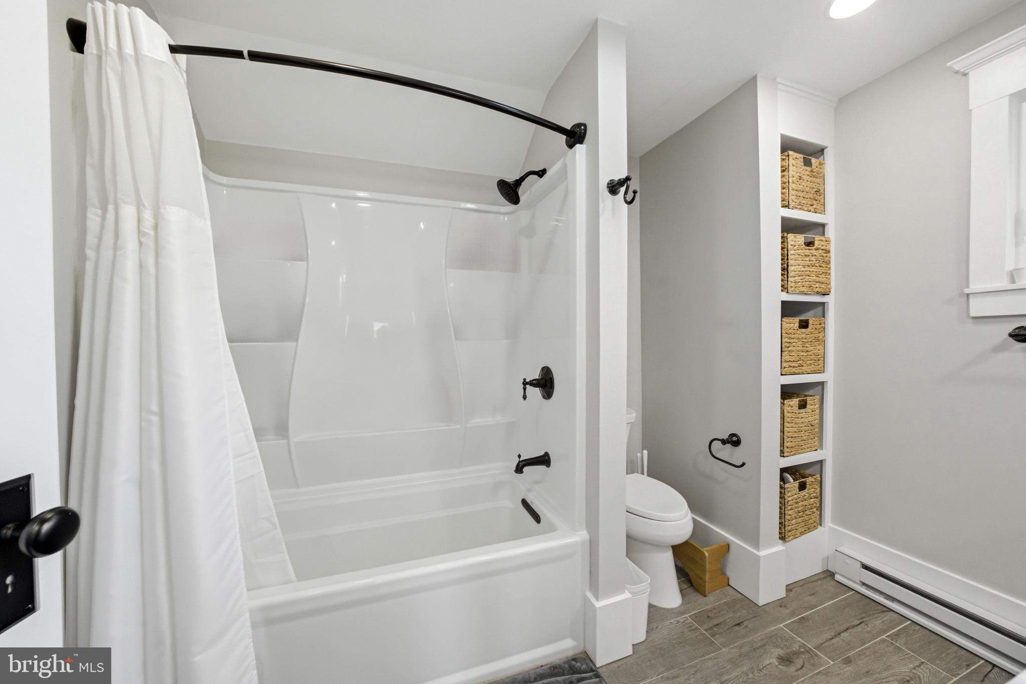 612 Grove Street Haddonfield, NJ 08033 - Photo 44 of 64 a bathroom with a bathtub a toilet and a shower