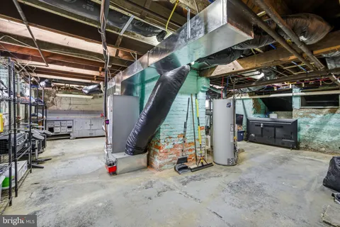 a front view of a building with a garden