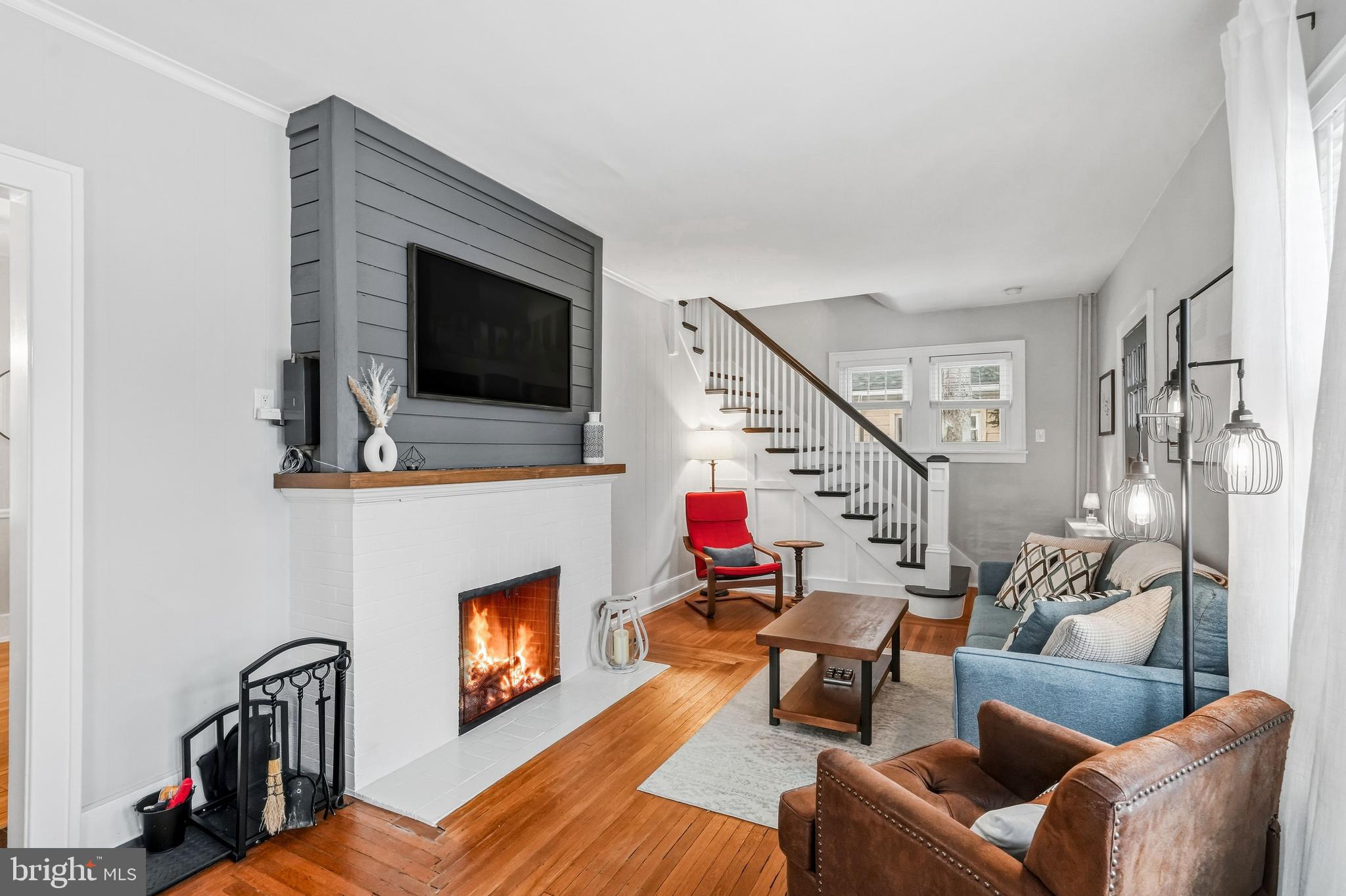 612 Grove Street Haddonfield, NJ 08033 - Photo 8 of 64 a living room with furniture a flat screen tv and a fireplace