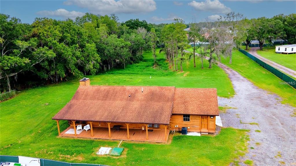6108 Lynn Road Tampa, FL 33625 - Photo 1 of 6 an aerial view of a house with swimming pool garden and patio