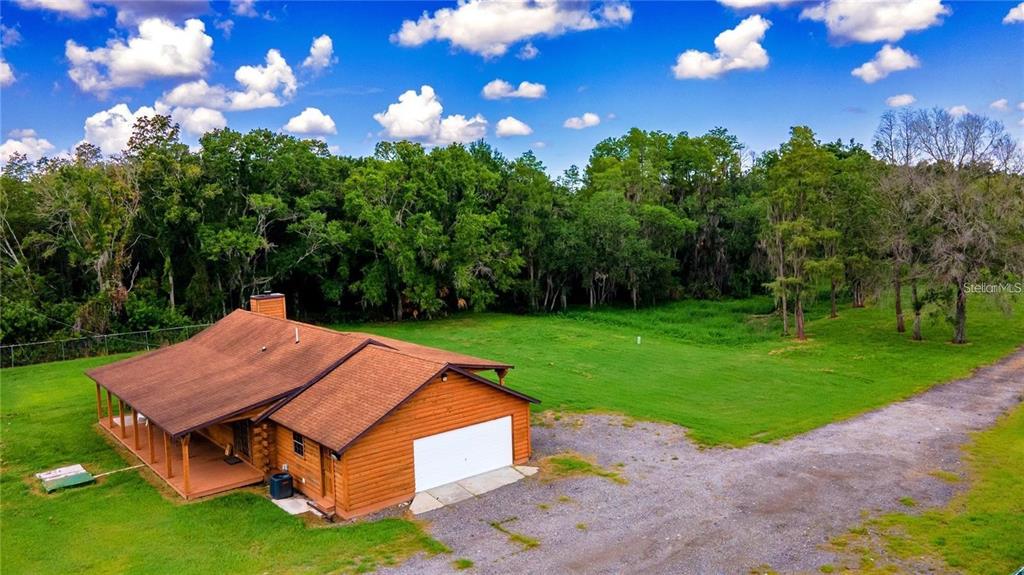 6108 Lynn Road Tampa, FL 33625 - Photo 2 of 6 a view of a house with a yard