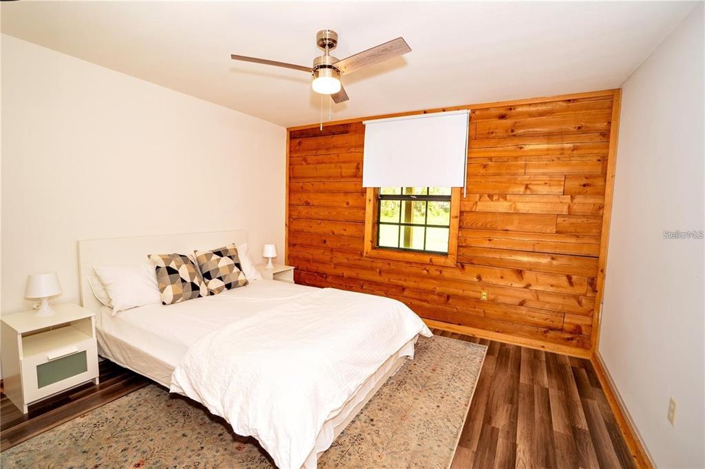 6108 Lynn Road Tampa, FL 33625 - Photo 5 of 6 a bedroom with a bed and a window