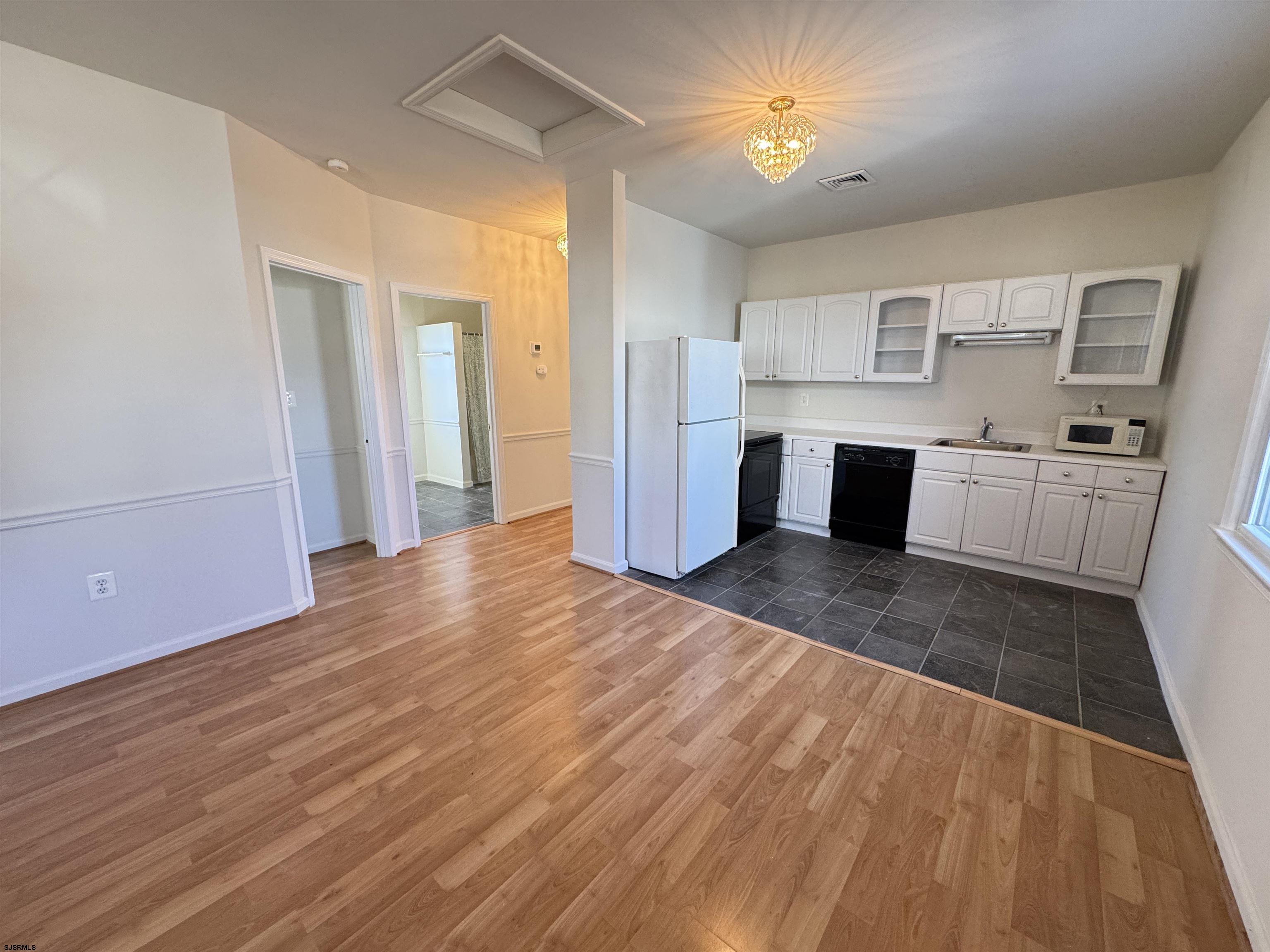 106 Harbor Road Marmora, NJ 08223 - Photo 11 of 11 a view of a kitchen with wooden floor and a sink