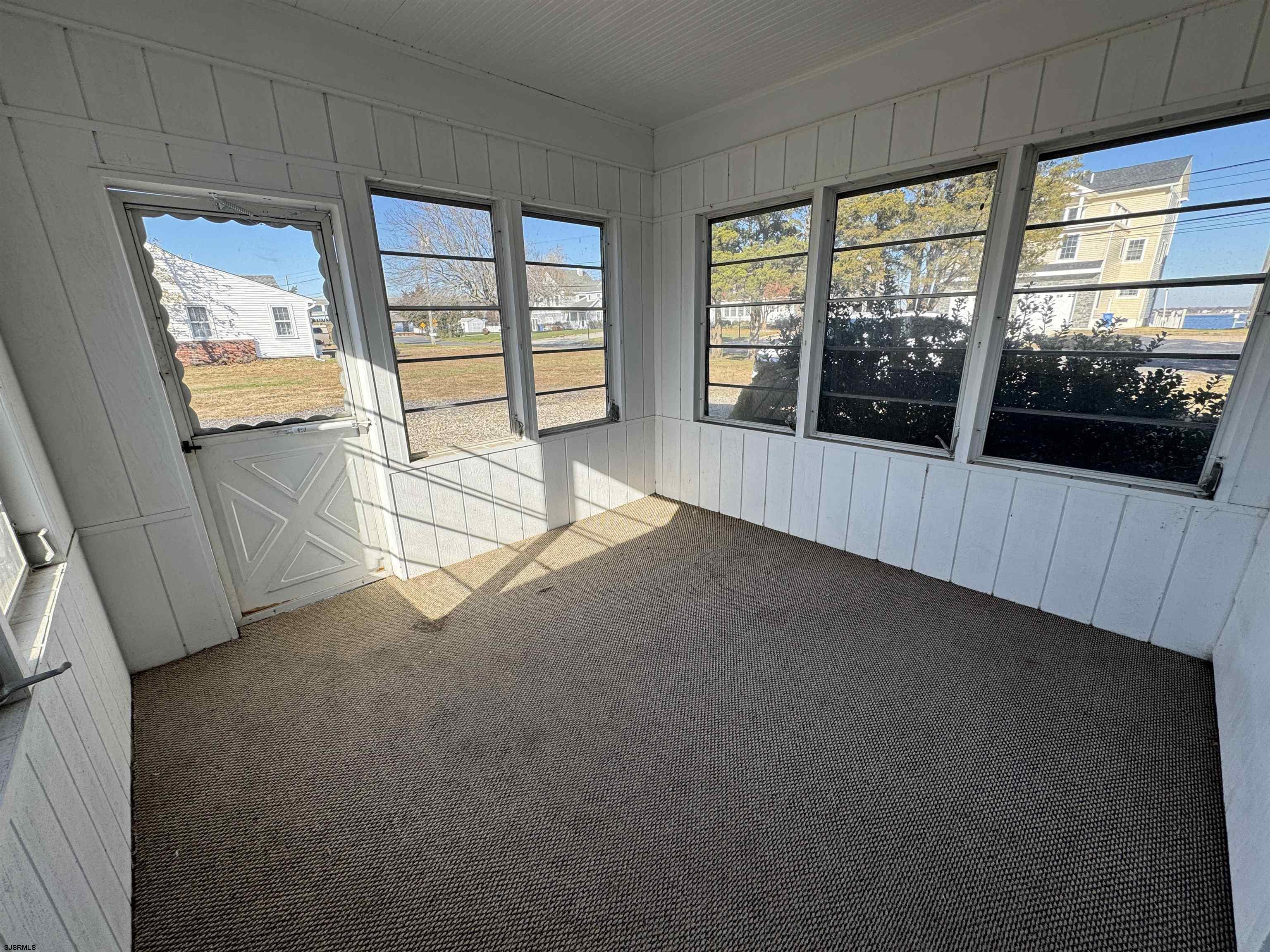 106 Harbor Road Marmora, NJ 08223 - Photo 9 of 11 a view of an empty room with a window