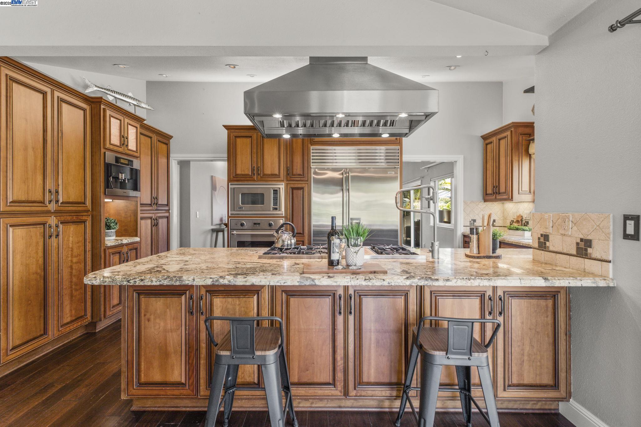 820 Pinehurst Place San Ramon, CA 94583 - Photo 11 of 54 a kitchen with stainless steel appliances granite countertop a stove a sink and a refrigerator