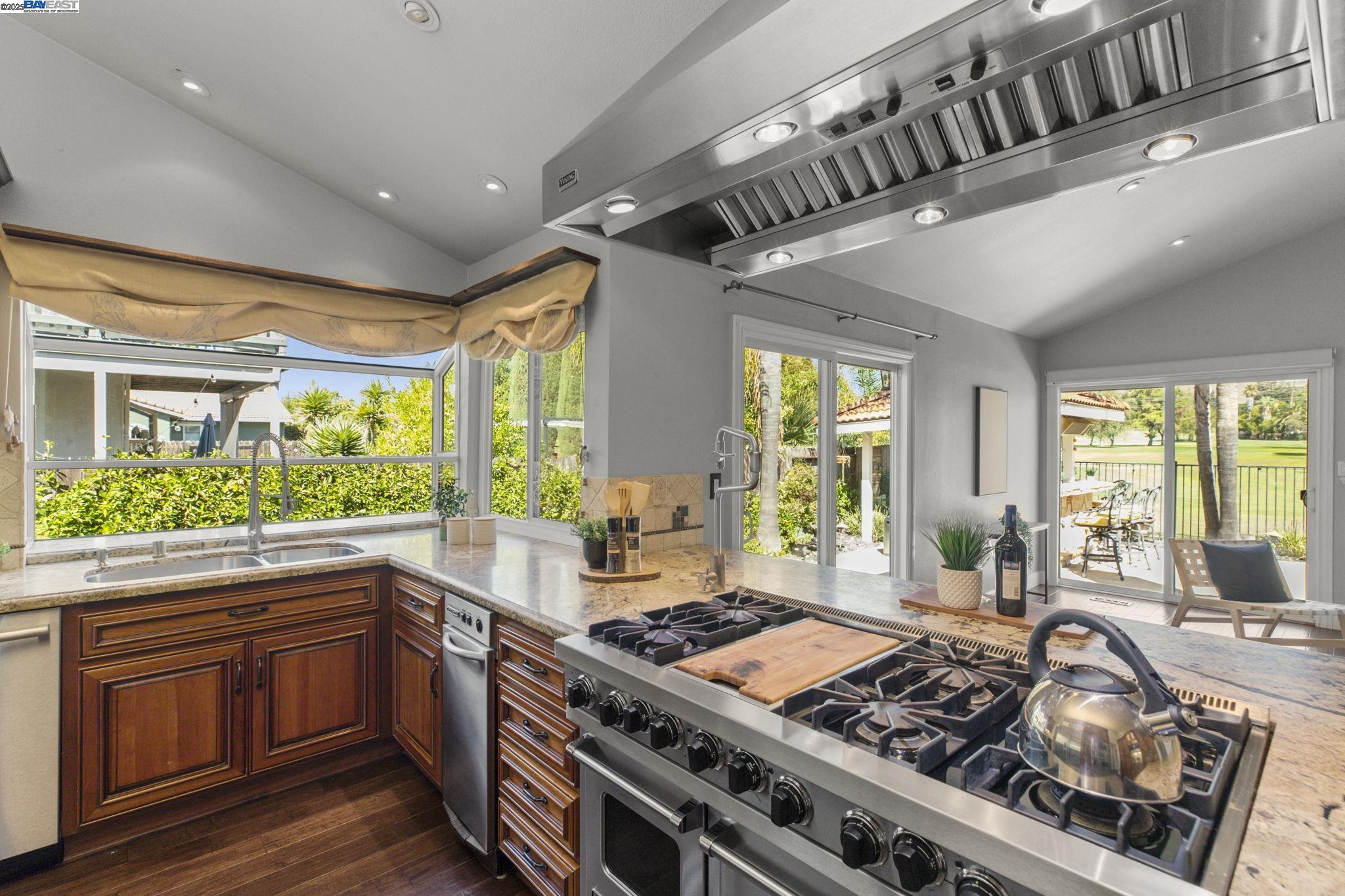 820 Pinehurst Place San Ramon, CA 94583 - Photo 14 of 54 a kitchen with a stove a sink and a refrigerator