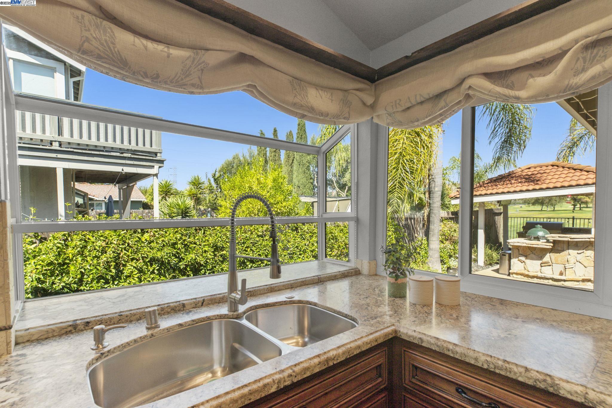820 Pinehurst Place San Ramon, CA 94583 - Photo 15 of 54 a kitchen with a sink and large windows