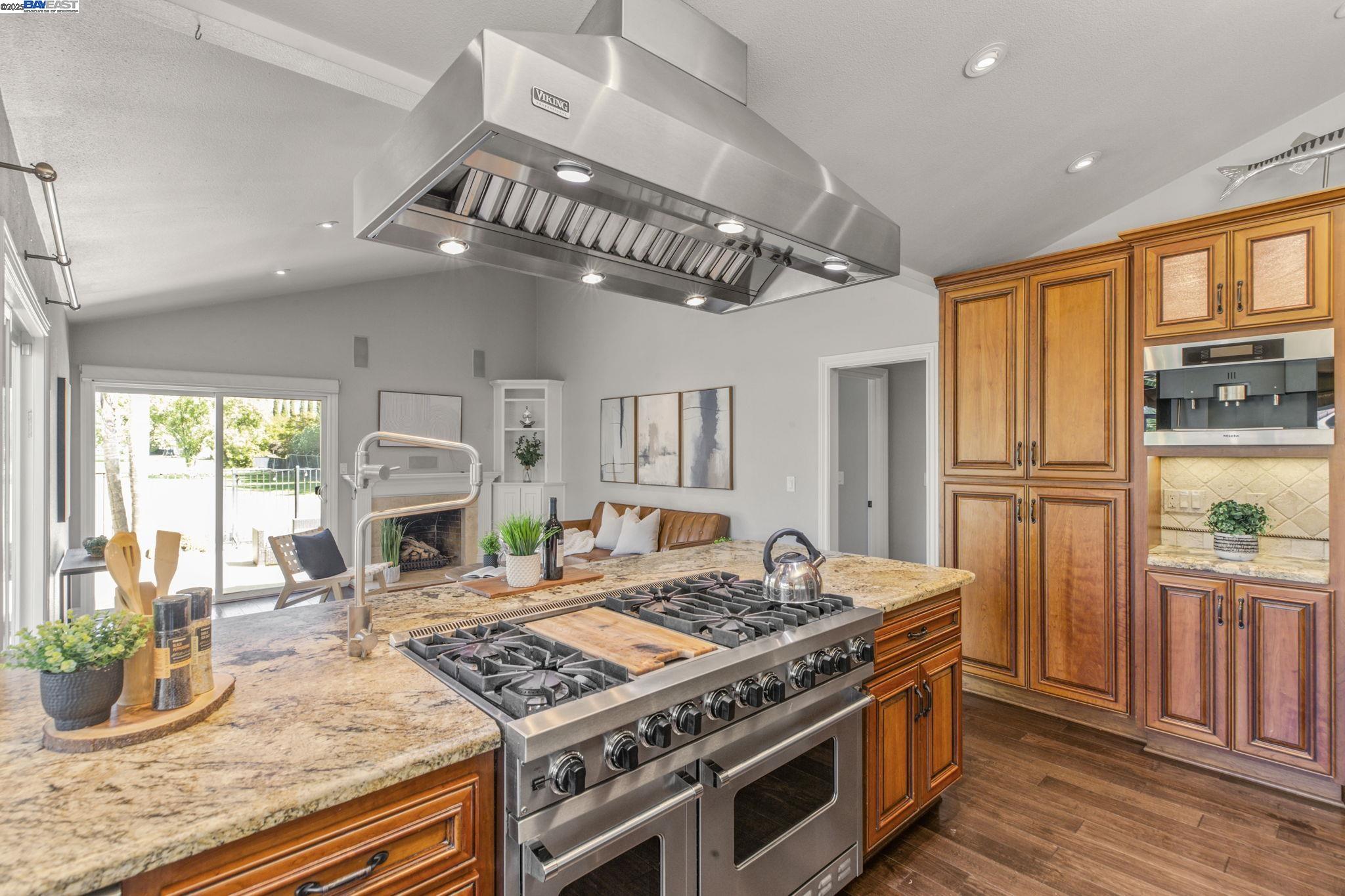 820 Pinehurst Place San Ramon, CA 94583 - Photo 17 of 54 a kitchen with stainless steel appliances granite countertop a stove refrigerator and a fireplace