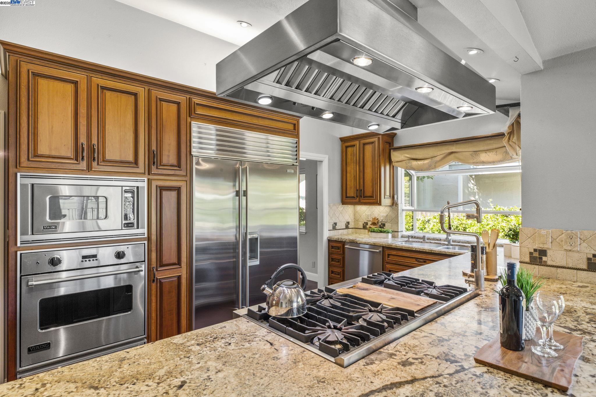 820 Pinehurst Place San Ramon, CA 94583 - Photo 18 of 54 a kitchen with a stove a refrigerator and ceiling fan