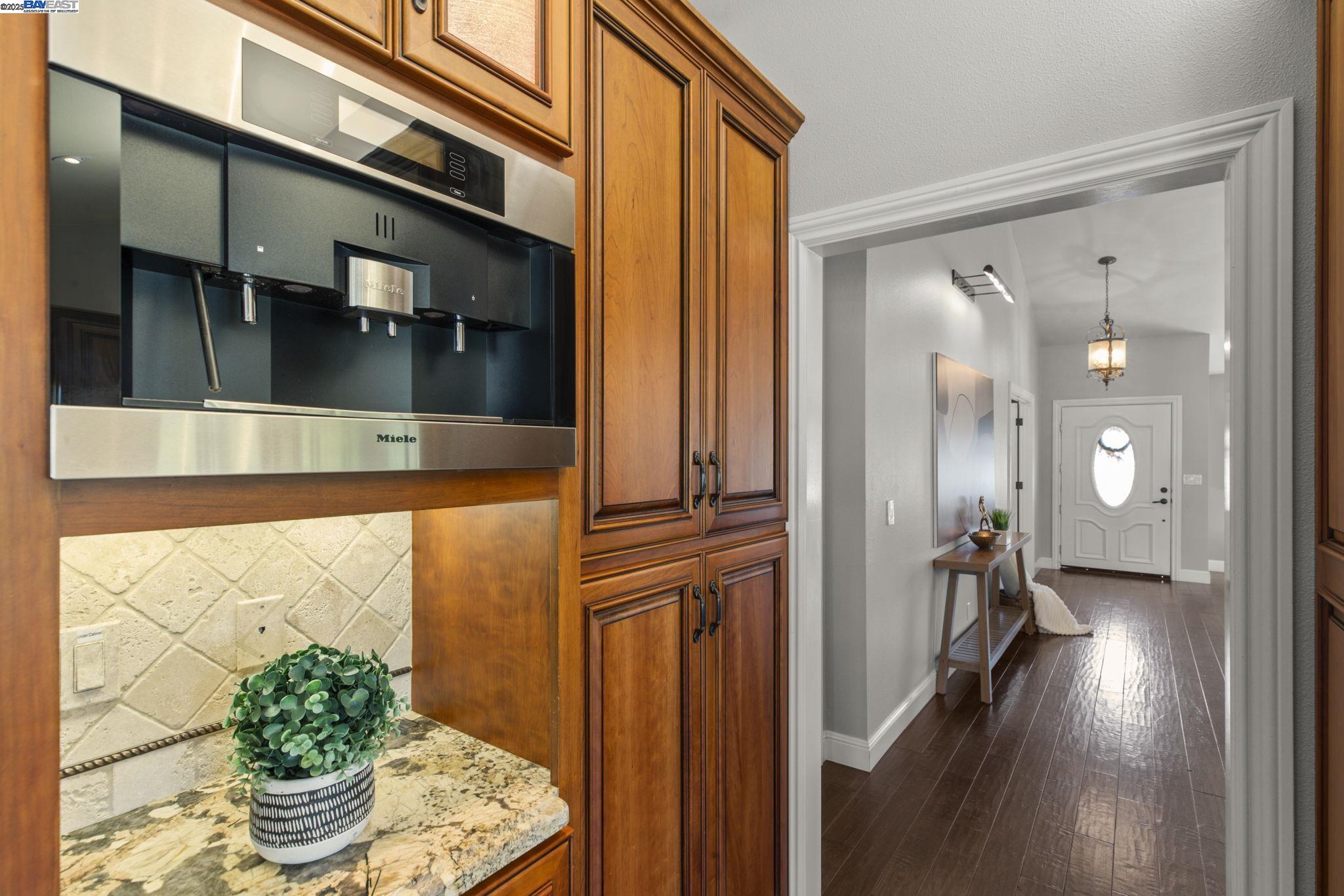 820 Pinehurst Place San Ramon, CA 94583 - Photo 20 of 54 a view of a hallway with wooden floor and a dining room