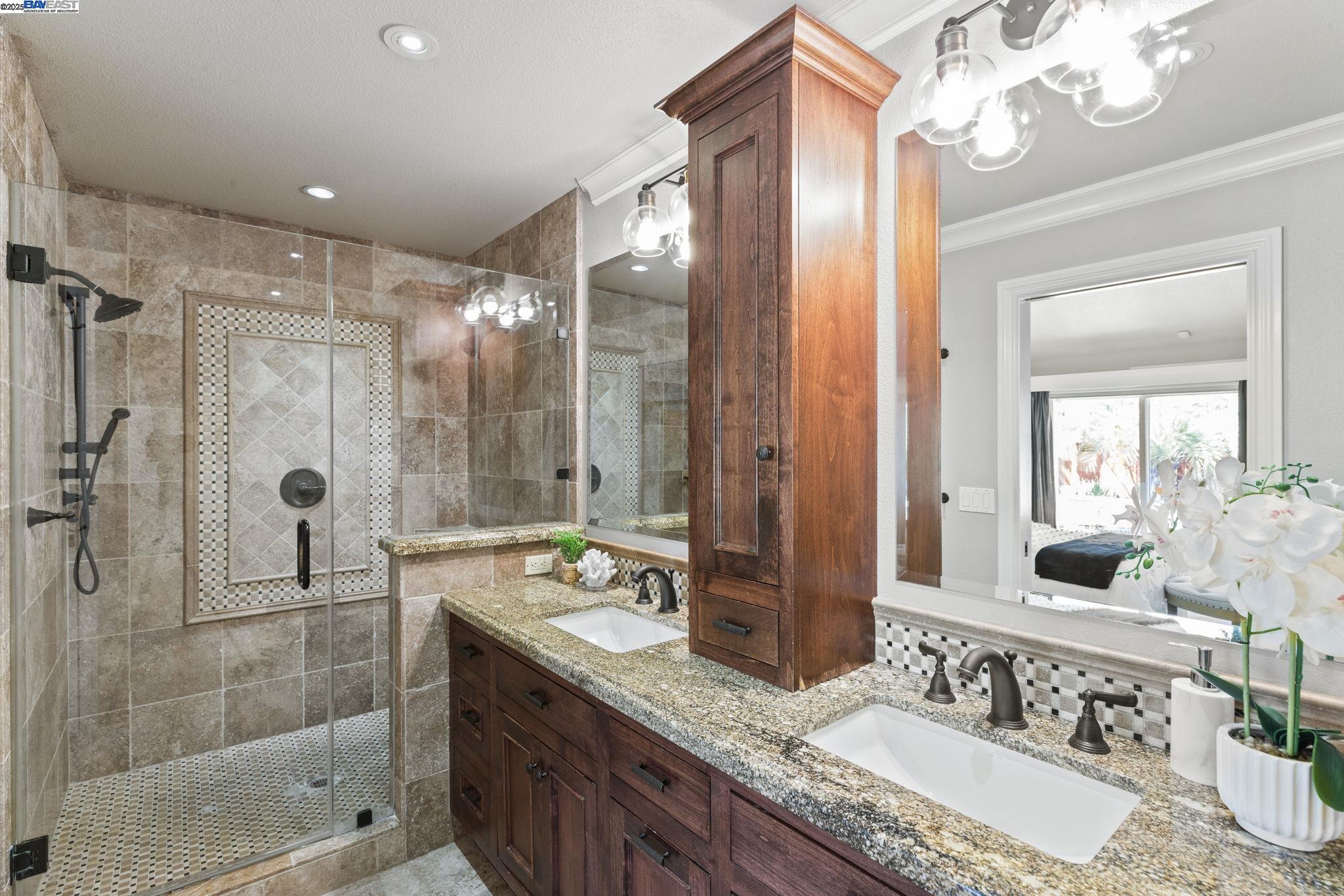 820 Pinehurst Place San Ramon, CA 94583 - Photo 25 of 54 a bathroom with a granite countertop double vanity sink mirror and shower