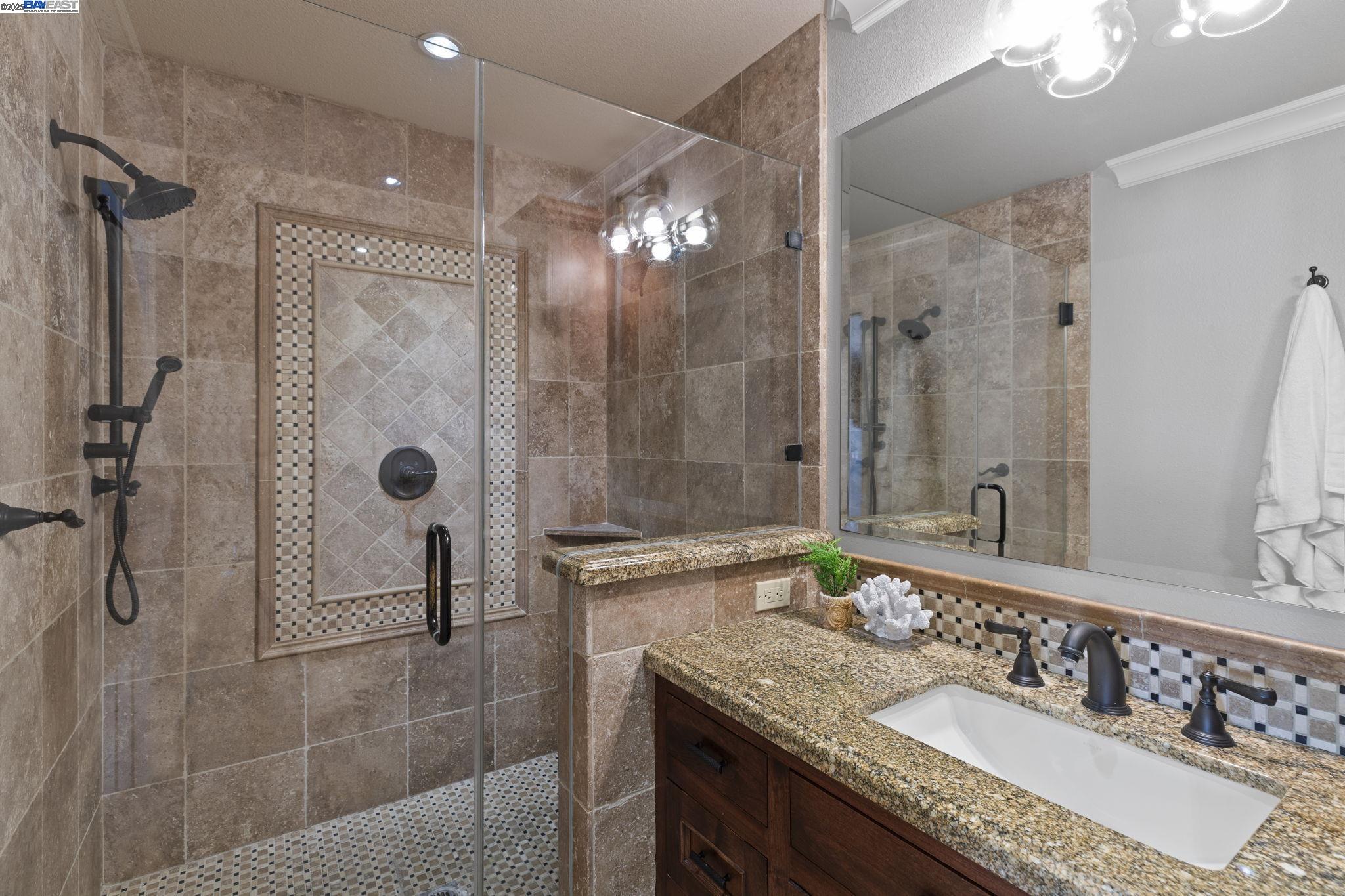820 Pinehurst Place San Ramon, CA 94583 - Photo 26 of 54 a bathroom with a granite countertop shower sink and mirror