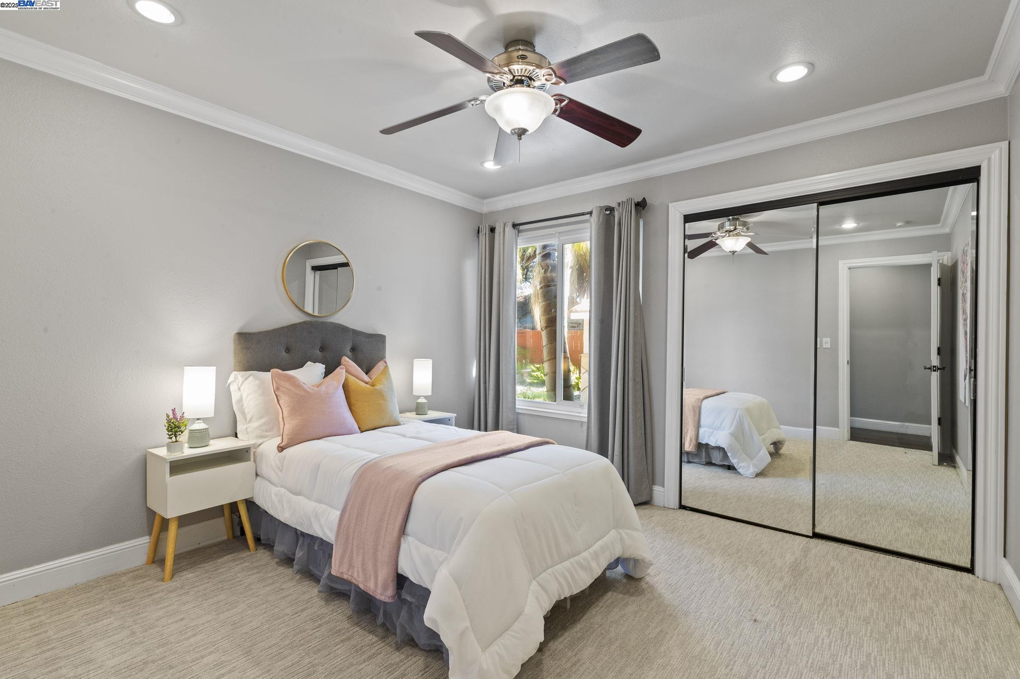 820 Pinehurst Place San Ramon, CA 94583 - Photo 27 of 54 a bedroom with a large bed and a chandelier