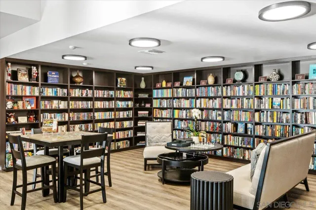 a reading room with furniture and book shelf