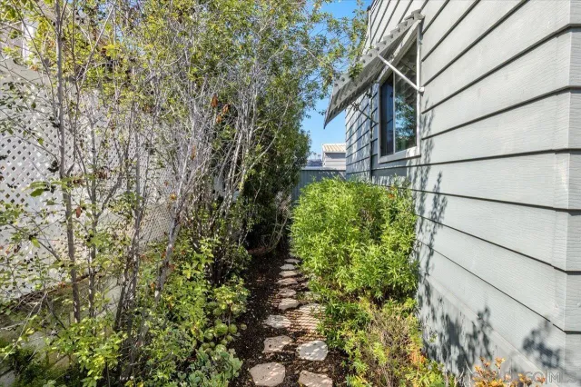 a view of a house with a tree