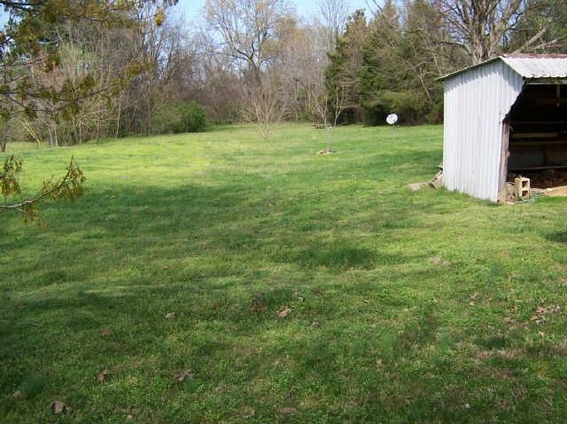 322 Dorris Road Portland, TN 37148 - Photo 3 of 8 a view of a house with a backyard