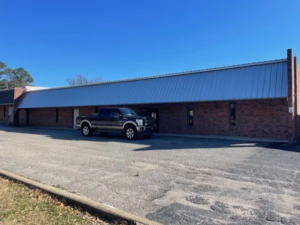 a view of a car parked in front of a house