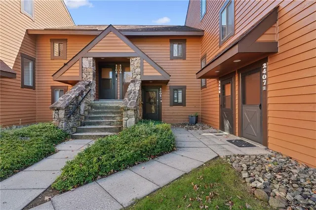 a front view of a house with garden