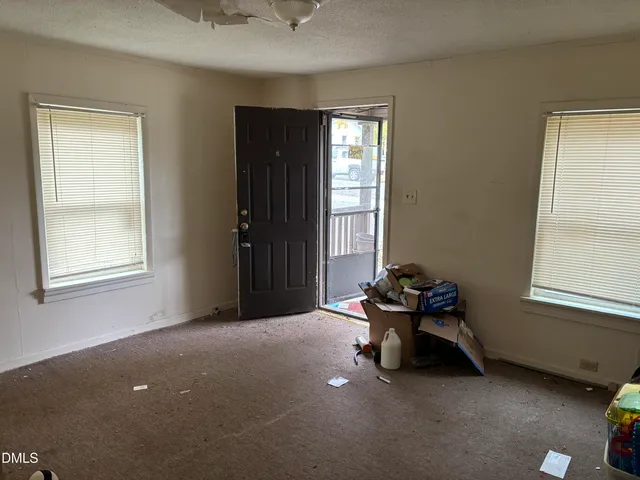 a kitchen with a refrigerator and a stove