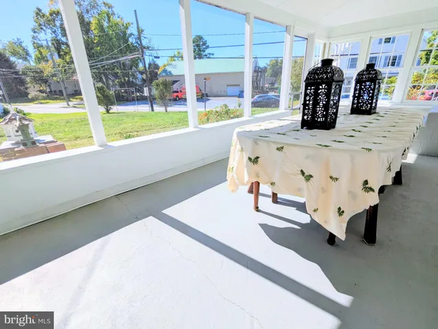 a view of staircase with railing and white walls