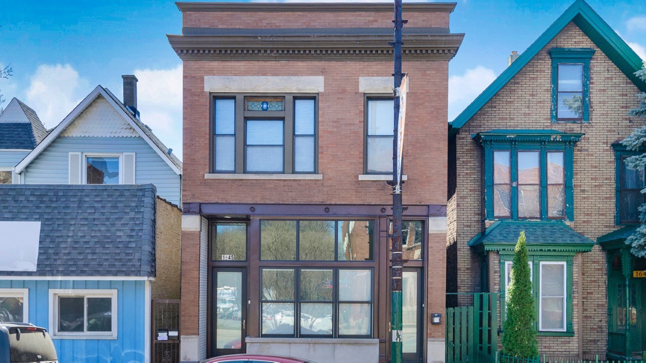 1645 West Irving Park Road Chicago, IL 60613 - Photo 1 of 33 a front view of a house with glass windows