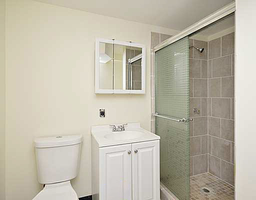 1645 West Irving Park Road Chicago, IL 60613 - Photo 11 of 33 a bathroom with a sink a toilet and shower
