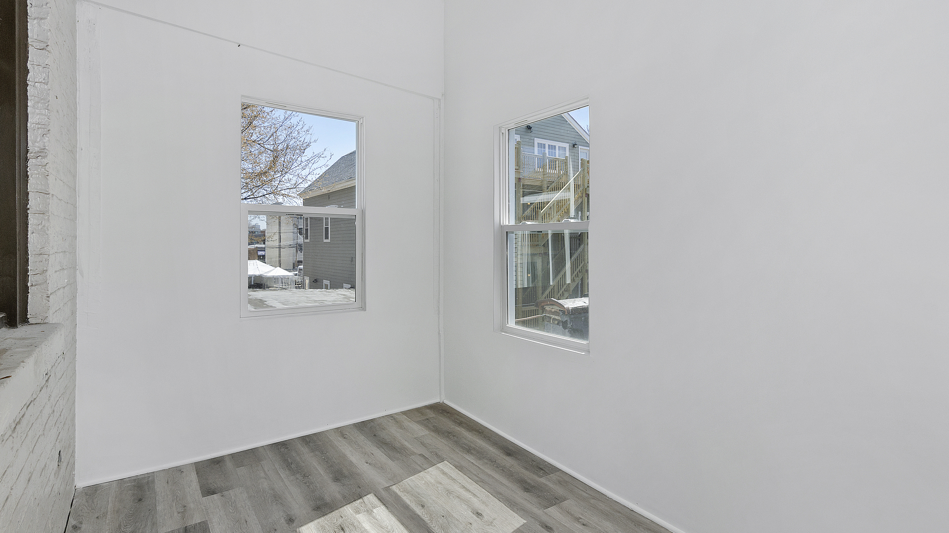 1645 West Irving Park Road Chicago, IL 60613 - Photo 17 of 33 an empty room with windows