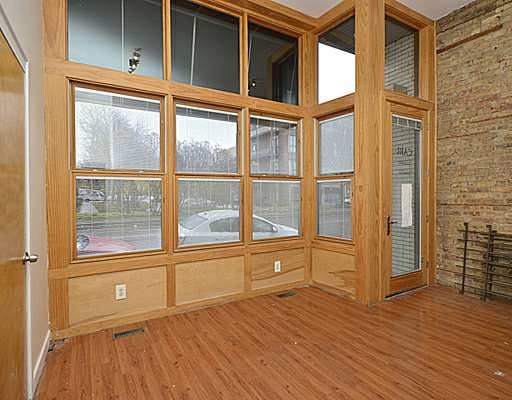 1645 West Irving Park Road Chicago, IL 60613 - Photo 2 of 33 view of an empty room with wooden floor and a window