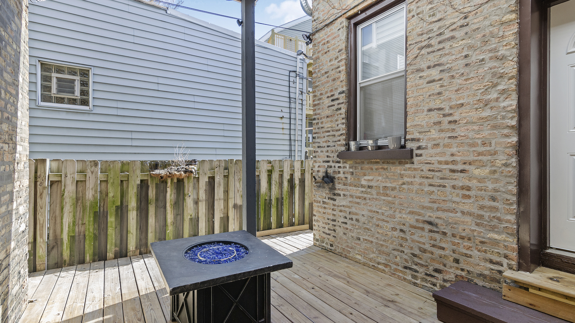 1645 West Irving Park Road Chicago, IL 60613 - Photo 24 of 33 a view of a wooden door with a bench